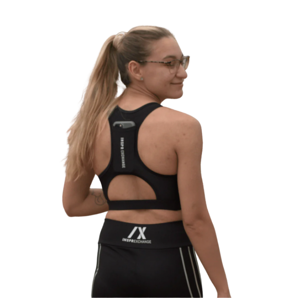 female athletic model posing for inspr exchange athletica while wearing black virago sport bra